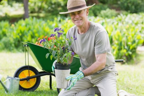 Volunteers and charity partners receiving donated plants and compost