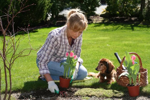 First aid kit and emergency response plan at a gardening worksite