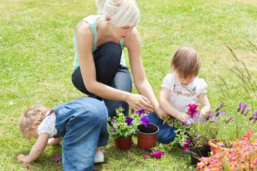 Middle-stage review meeting between gardeners and manager